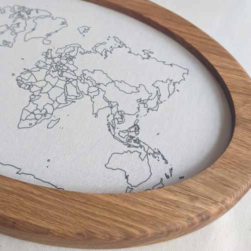 Close up of the world map fabric and the oak frame