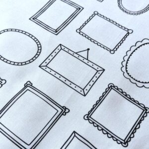 WHite fabric with the outlines of simple picture frames printed on it
